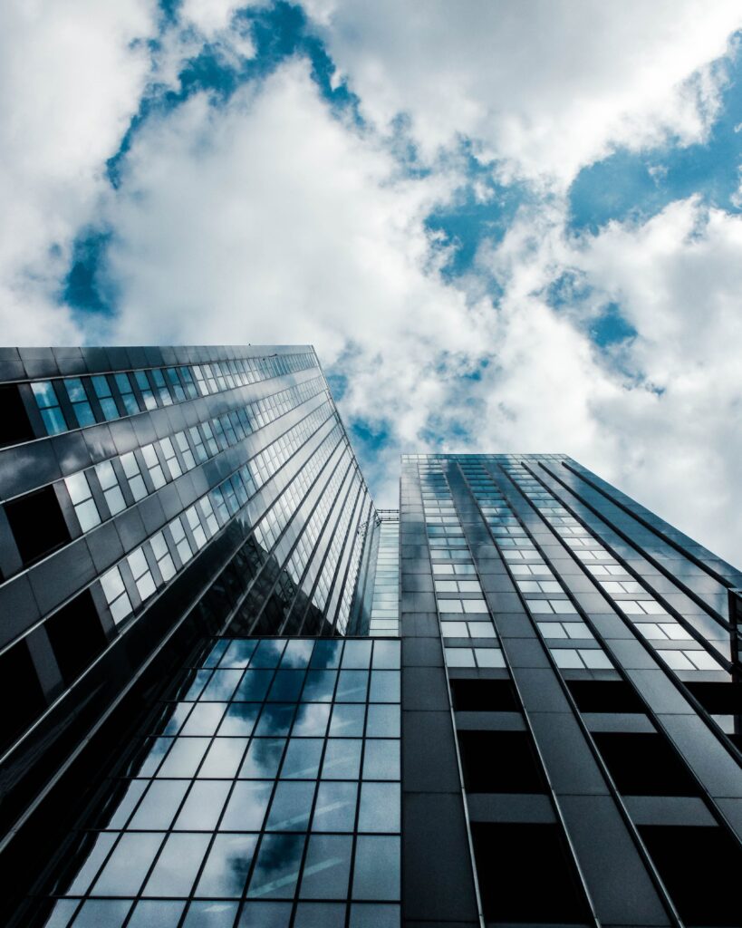 pexels-photo-28744085-28744085 Modern skyscraper reflecting the sky in Rotterdam, showcasing urban architecture.